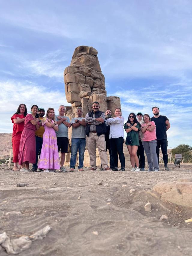 Our guide with a group of travelers at the Colossi of Memnon, Luxor